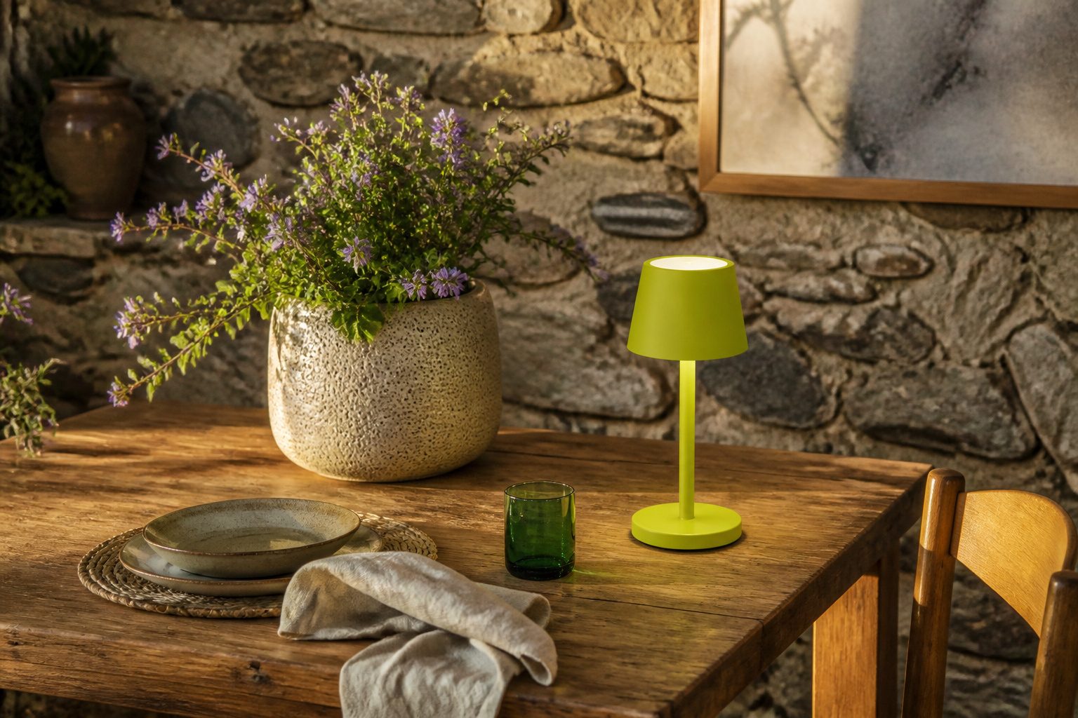 A dining table with decorations and tableware arranged attractively.