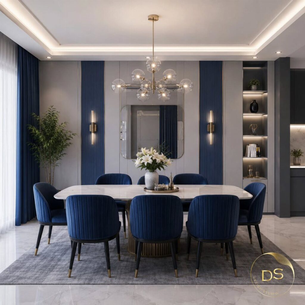 Navy blue velvet dining chairs arranged around a white marble table in a modern room.