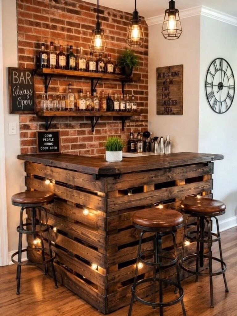 A rustic home bar constructed from wooden pallets with warm lights and liquor bottles on brick walls.